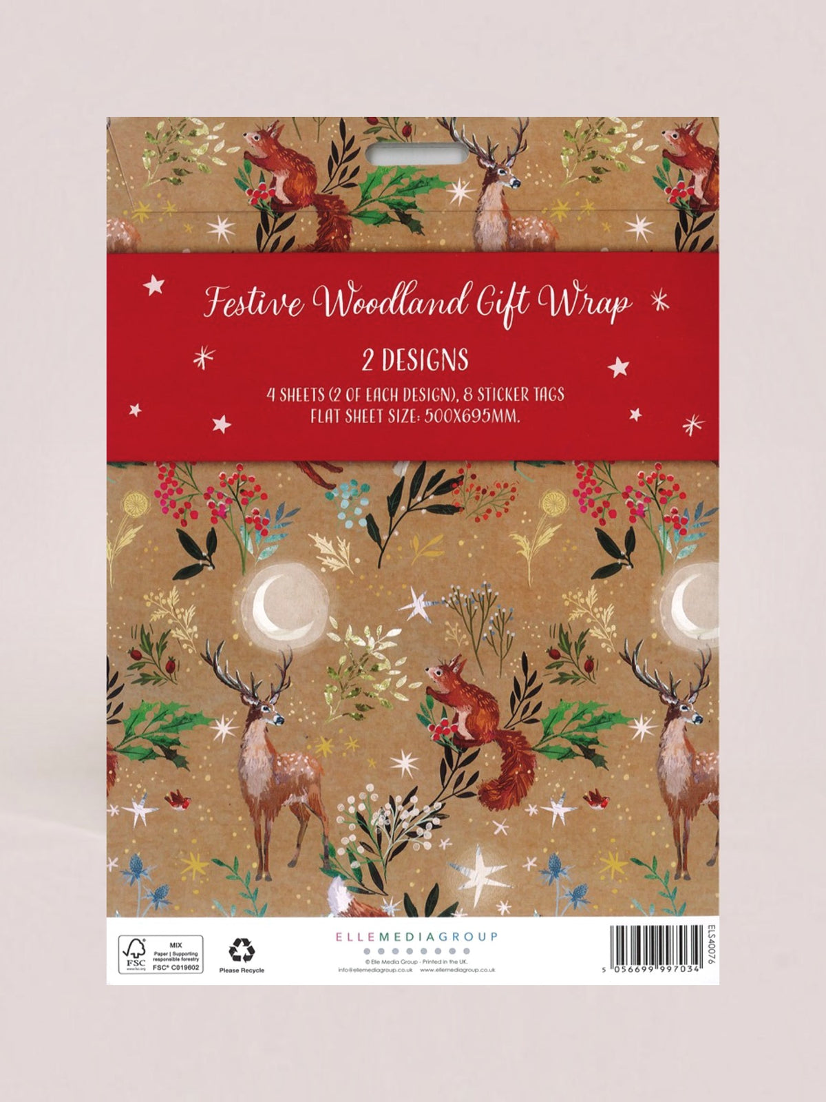 Festive Woodland Gift Wrap packaging by Ellemedia Group, featuring a red banner across the top and a woodland pattern with deer, foxes, trees, and stars on a beige background.